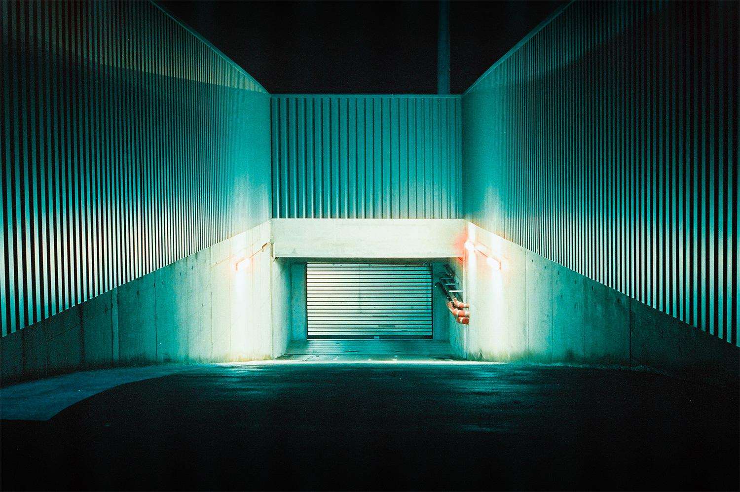Analog photo of a garage entrance at night.